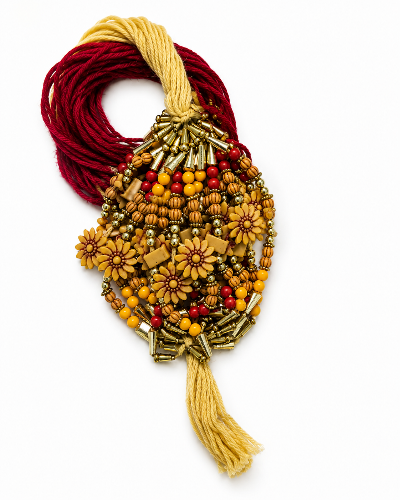 A beaded and woven decorative  featuring yellow-gold floral beads, red and gold seed beads, 