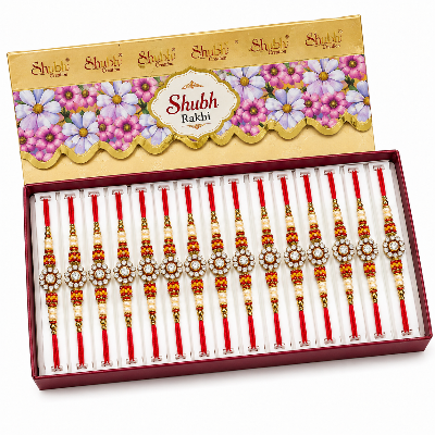 A boxed set of Shubh Rakhi wristbands displayed open in a red tray, with the matching branded box lid shown above. 