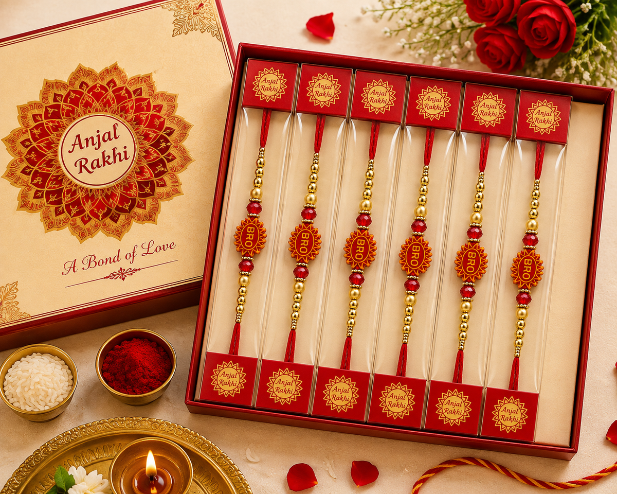 An open red gift box displaying Anjal Rakhi wristlets arranged vertically
