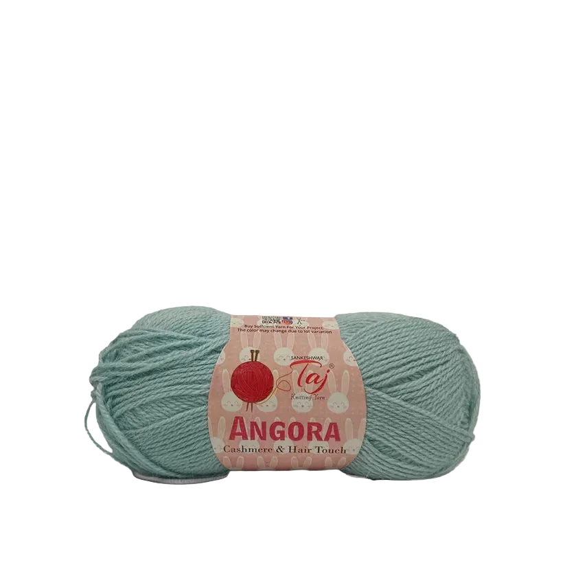 A skein of Angora yarn in a dusty sage green color with a pink paper label, shown on a clean white background.