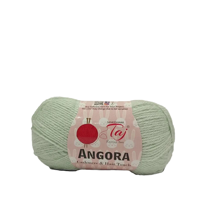 A single ball of pale sage green yarn with a pink paper label reading 'Angora'