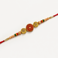 A traditional Indian Rakhi bracelet laid diagonally