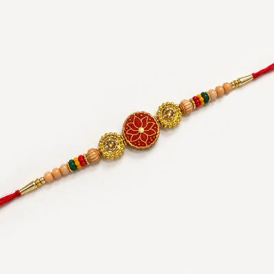 A traditional Indian Rakhi bracelet laid diagonally