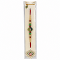 A traditional Indian Rakhi bracelet in its original clear plastic packaging
