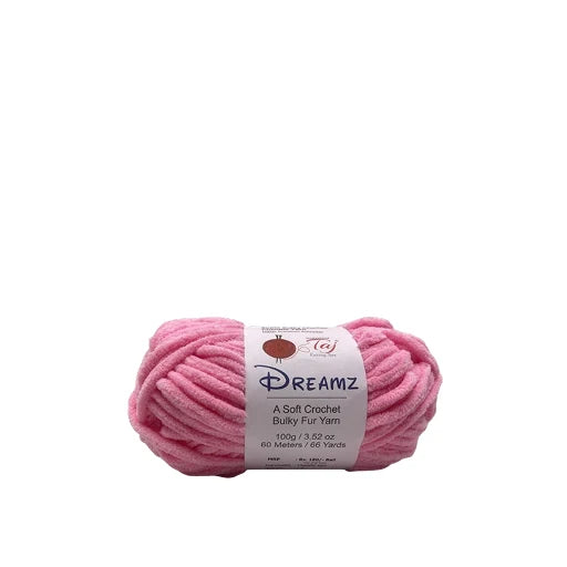 A skein of pink Dreamz bulky fur yarn with a white paper label,