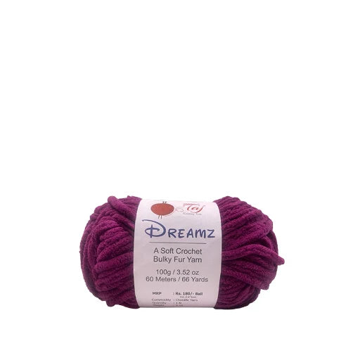 A skein of Dreamz Bulky Fur Yarn in a deep purple shade, featuring a white paper label
