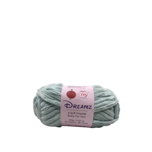 A skein of Dreamz Bulky Fur Yarn in a pale sage green color,