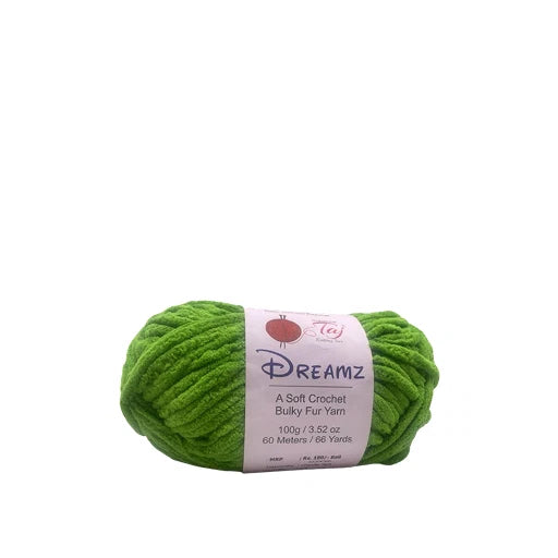 A skein of bright green Dreamz soft crochet bulky fur yarn with a white paper label