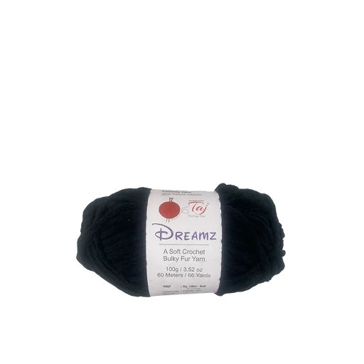 A skein of black Dreamz soft crochet bulky fur yarn with a white paper label, shown against a plain white background.