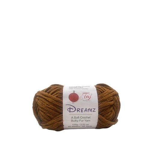 A skein of brown crochet yarn with a white paper label that reads 'Dreamz'