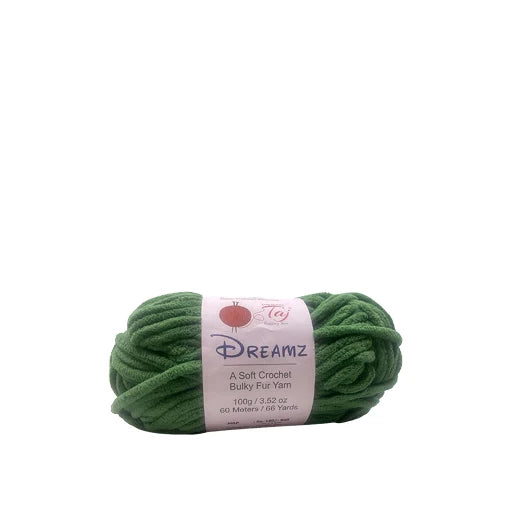 A skein of green bulky yarn wrapped with a white paper label that reads 'DREAMZ 