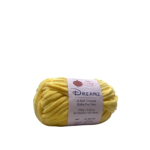 A skein of yellow Dreamz Bulky Fur Yarn with a white paper label,