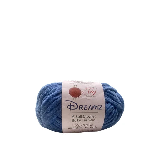 A skein of blue Dreamz Bulky Fur Yarn with a white paper label,