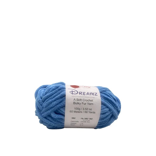 A skein of blue Dreamz Bulky Fur Yarn with a white paper label, photographed on a solid white background.