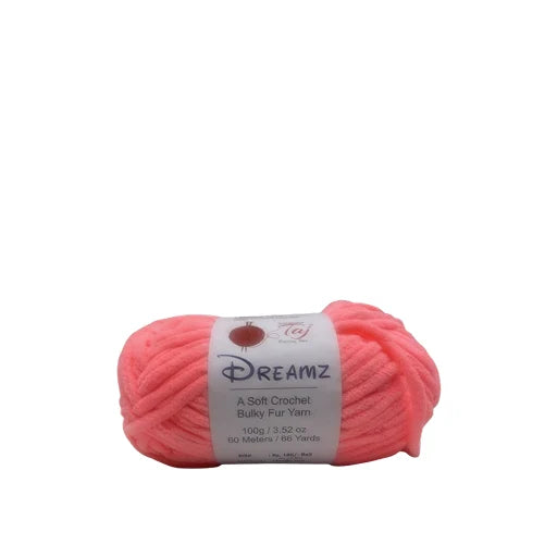 A skein of bright pink Dreamz bulk yarn with a white paper label, shown on a plain white background.
