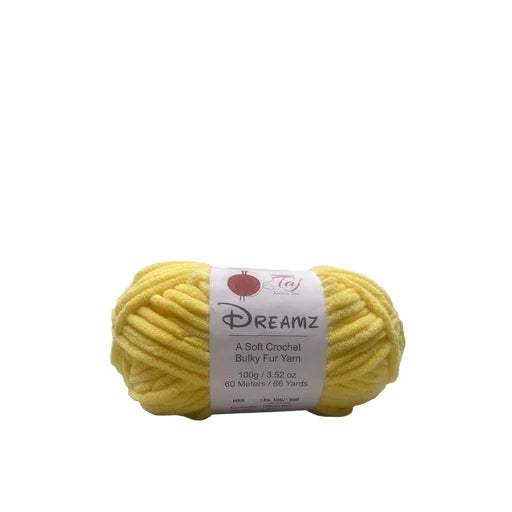 A skein of yellow Dreamz crocheted yarn with a white paper label,