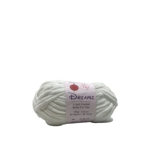 A skein of Dreamz brand chunky fur yarn in a soft off-white color, wrapped with a white paper label.