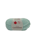 A skein of light mint green cashmere yarn with a white paper label