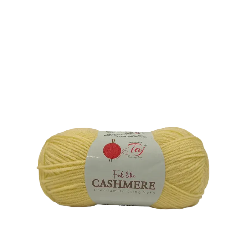 A skein of pale yellow yarn with a white paper label that reads 'Feel like CASHMERE premium Knitting Yarn' 