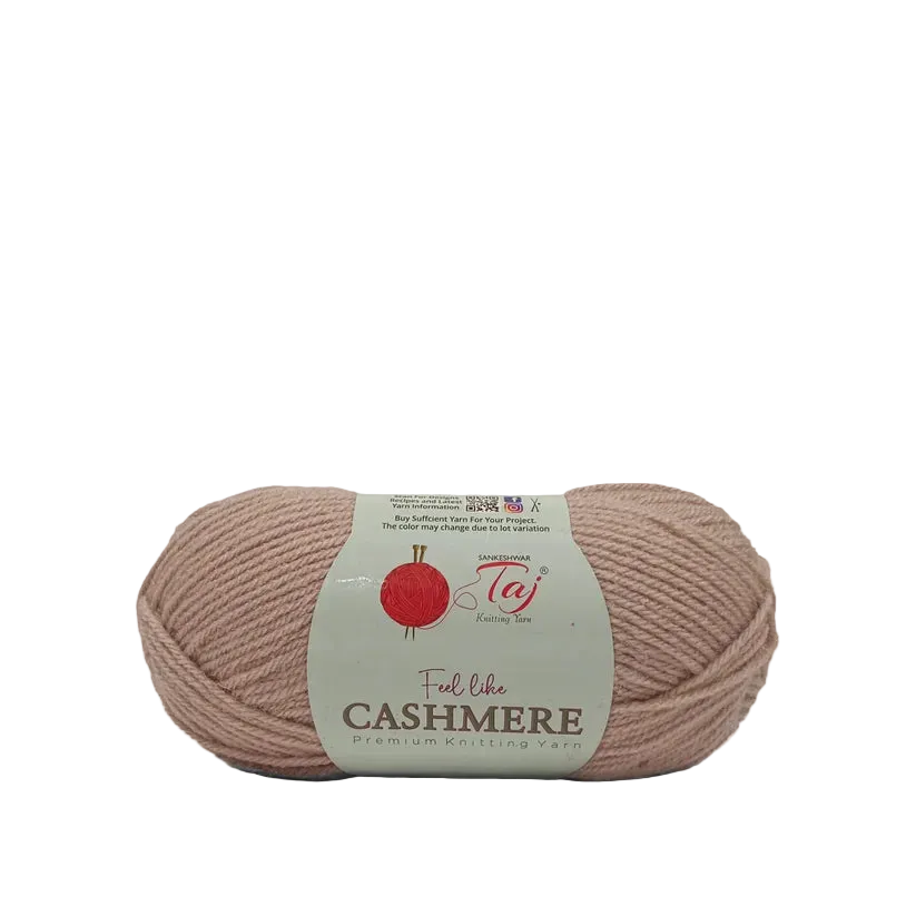A skein of dusty pink Cashmere yarn with a white paper label
