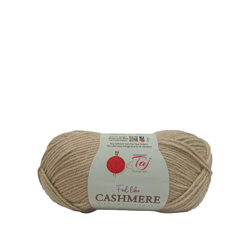 A single skein of Taj Cashmere yarn in a light beige color, featuring a white paper label