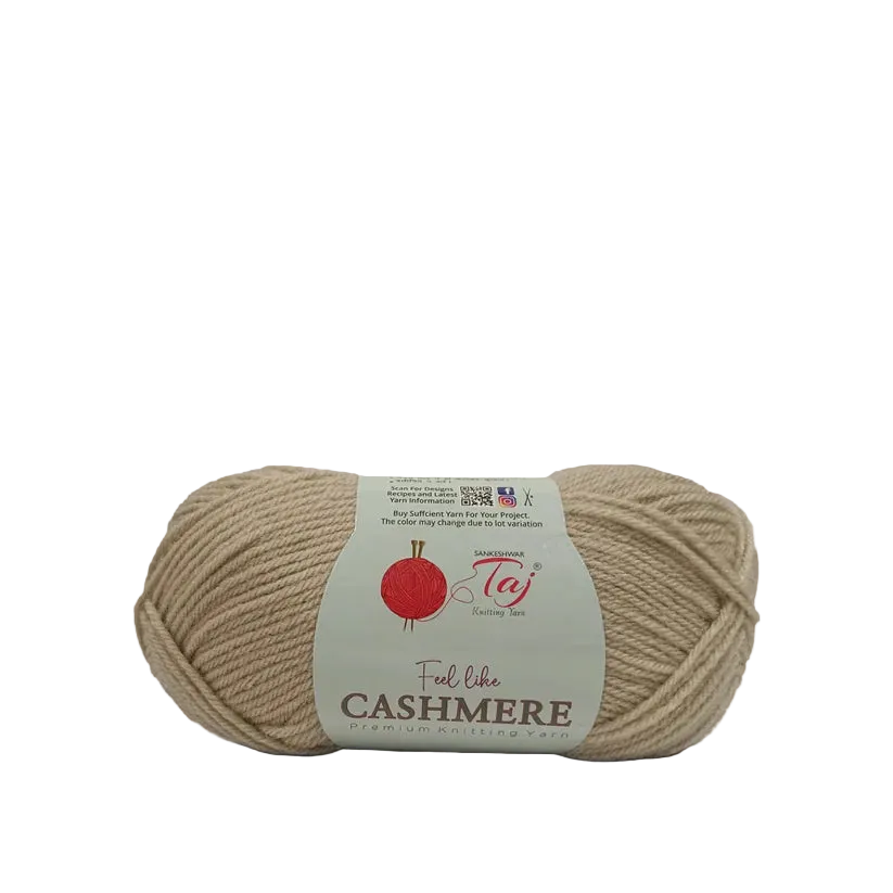 A skein of beige yarn with a white paper label that reads 'Feel like CASHMERE'