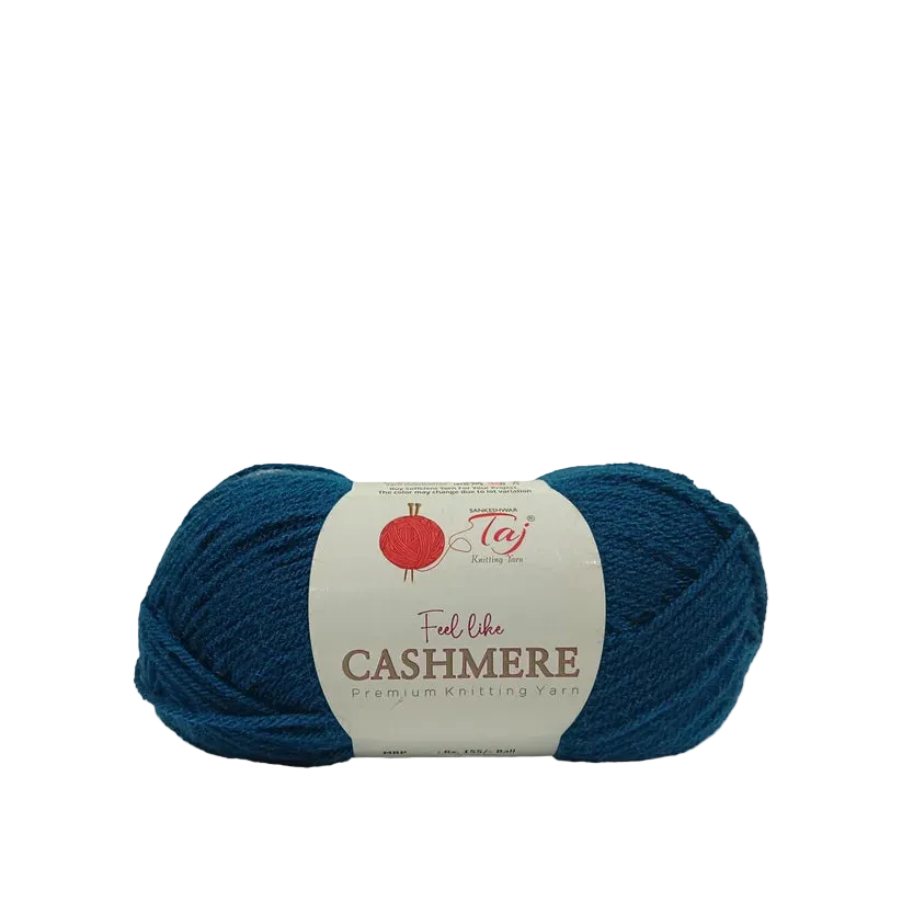 A skein of teal blue cashmere yarn with a white paper label that reads