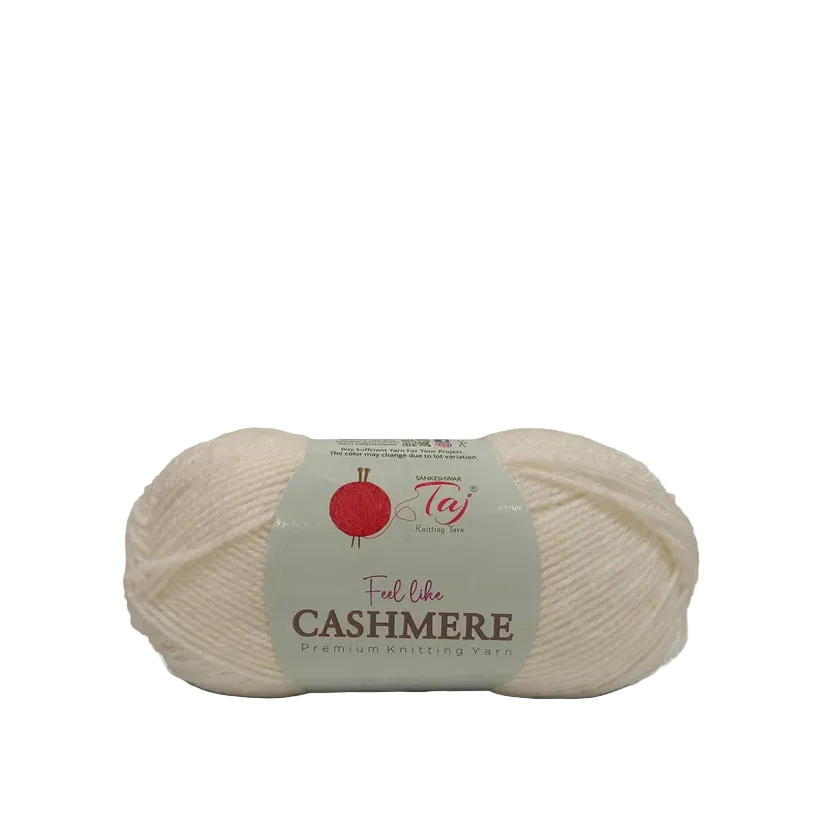 A skein of cream-colored yarn with a paper label that reads 'Feel like CASHMERE Premium Knitting Yarn'