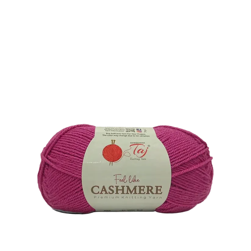 A skein of magenta pink yarn with a cream paper label that reads 'Feel like CASHMERE premium knitting yarn'