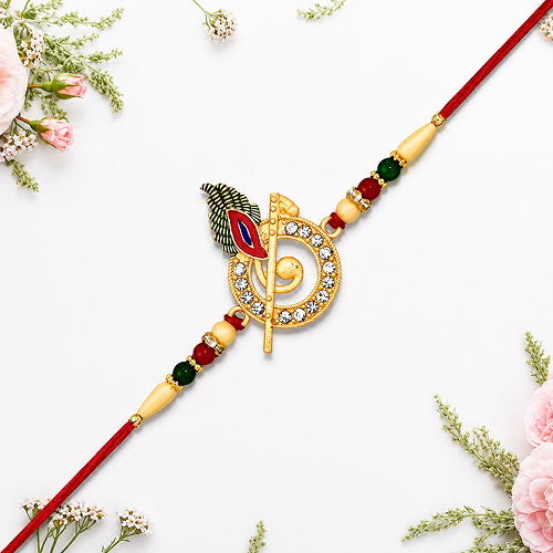 A gold-plated Hindu Rakhi with a Swastika symbol