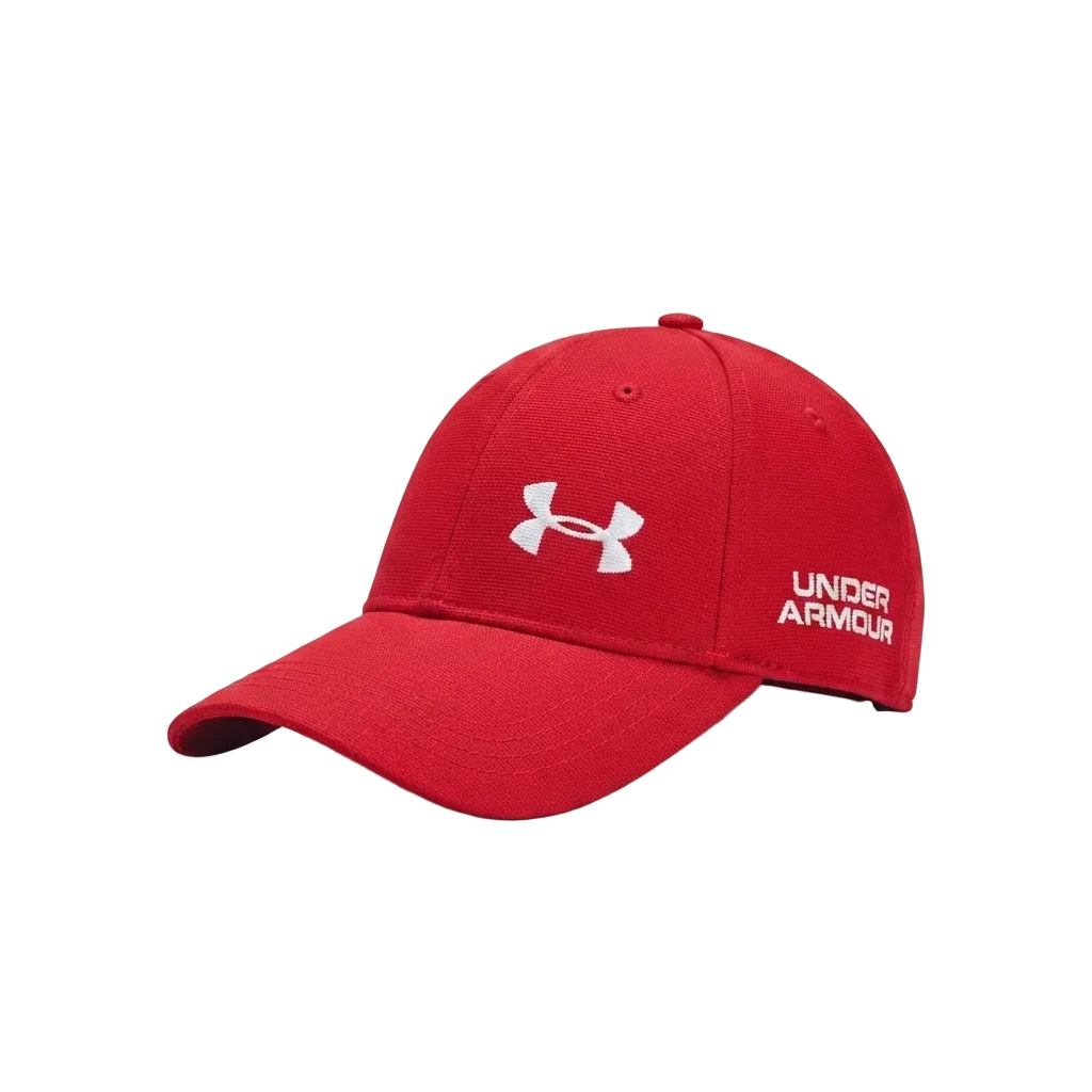 A red Under Armour baseball cap with a white embroidered logo on the front and side, shown on a light gray background.