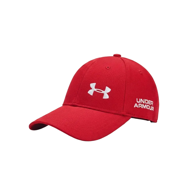 A red Under Armour baseball cap with a white embroidered logo on the front and side, shown on a light gray background.