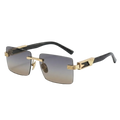 Rimless square sunglasses with gradient gray lenses, gold metal hardware, and black temples on a clean white background.