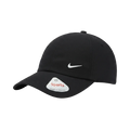 A black Nike baseball cap with a white embroidered Swoosh logo on the front and a white sticker on the brim, photographed on a clean white background.