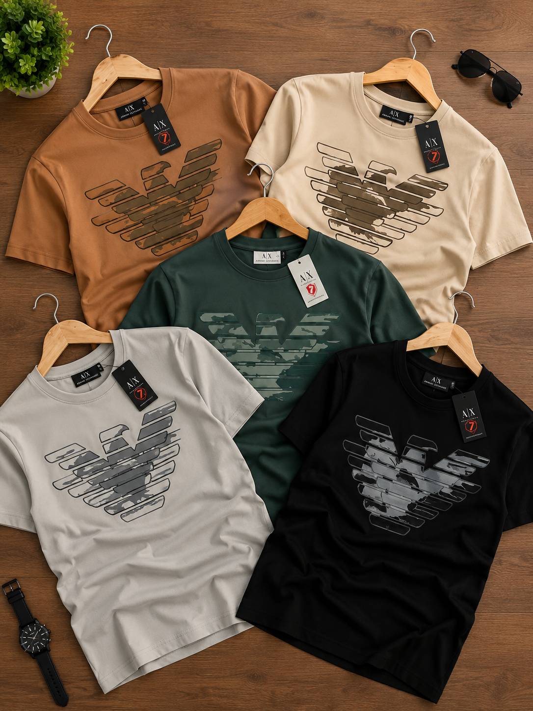 Five short-sleeve crew-neck T-shirts from Emporio Armani in assorted colors.