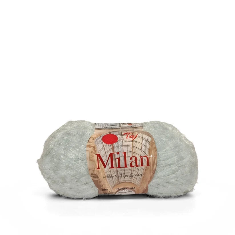 A ball of light gray plush yarn with a paper label wrapped around it,