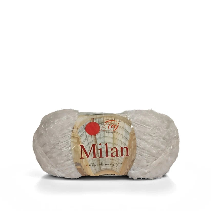 A single skein of light gray yarn with a paper label reading 'Milan' and 'Tay',