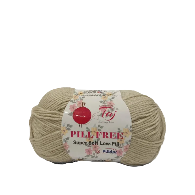 A skein of beige Pilefree yarn with a white paper label featuring a red apple logo.