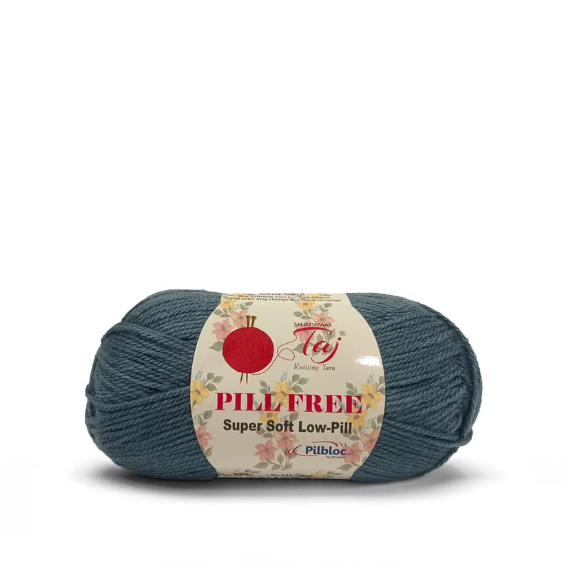 A skein of teal blue yarn with a cream-colored label that reads 'PILL FREE Super Soft Low-Pill' 