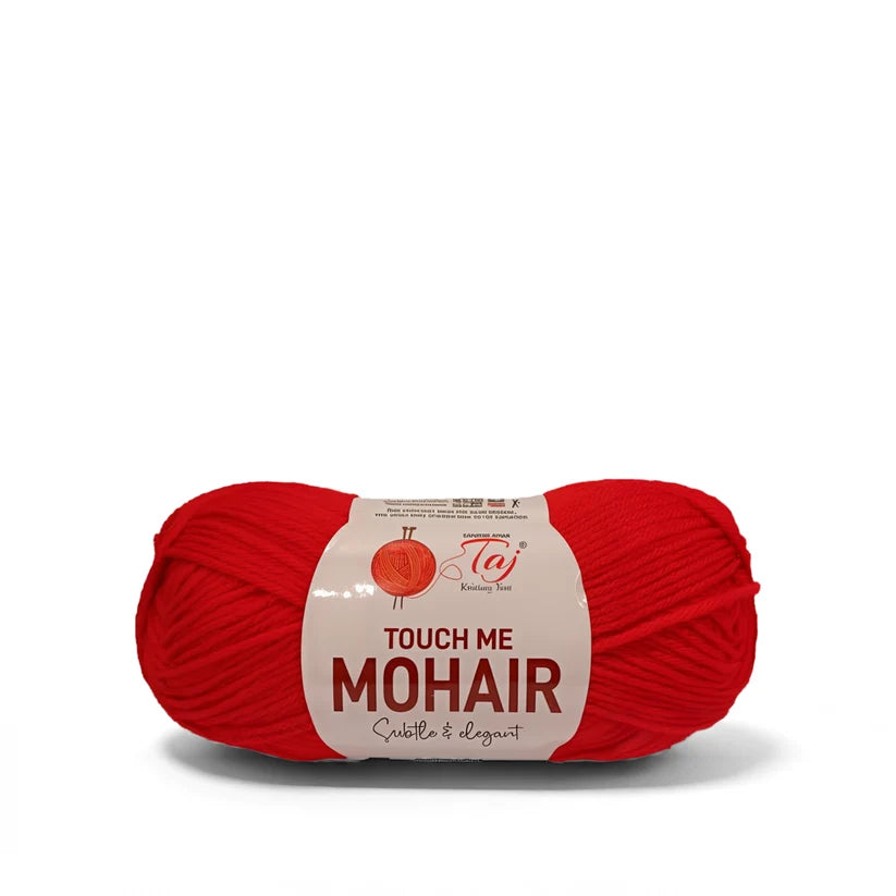 A skein of bright red mohair yarn with a paper label reading 'TOUCH ME MOHAIR' 