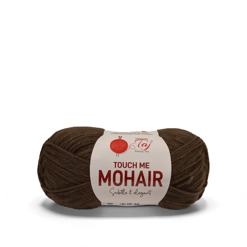 A skein of brown mohair yarn with a white paper label that reads 'TOUCH ME MOHAIR'