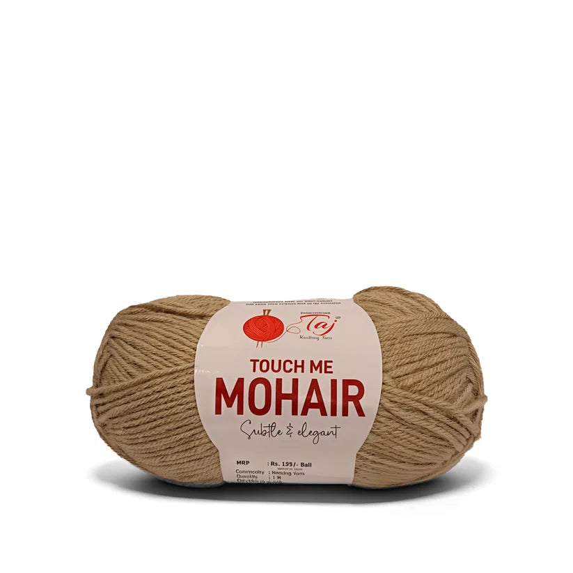 A skein of Mohair yarn in a warm tan color, wrapped with a white paper label
