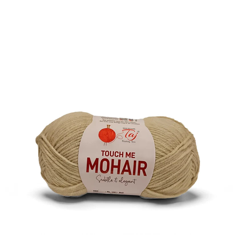 A skein of Mohair yarn in a light beige color, wrapped with a white paper label