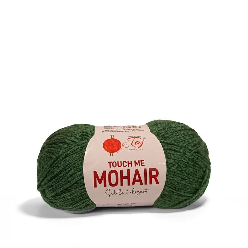 A skein of dark green mohair yarn with a beige paper label that reads 'TOUCH ME MOHAIR' 
