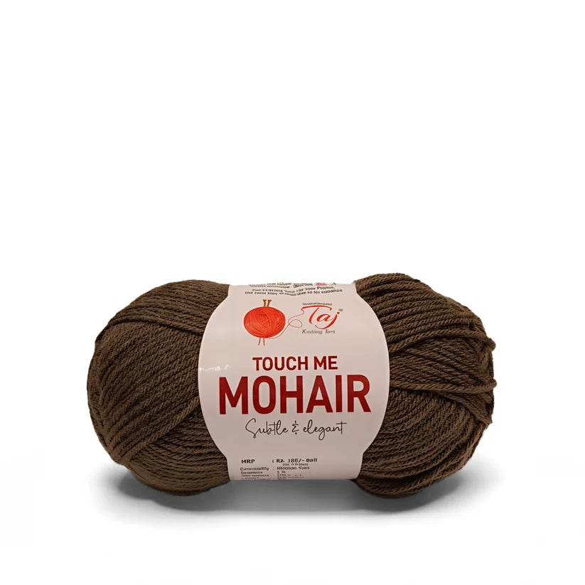 A skein of brown mohair yarn with a white paper label reading 'TOUCH ME MOHAIR'