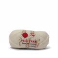 A single spool of cream-colored yarn with a paper label reading 'PILLFREE Super Soft Low-Pill'