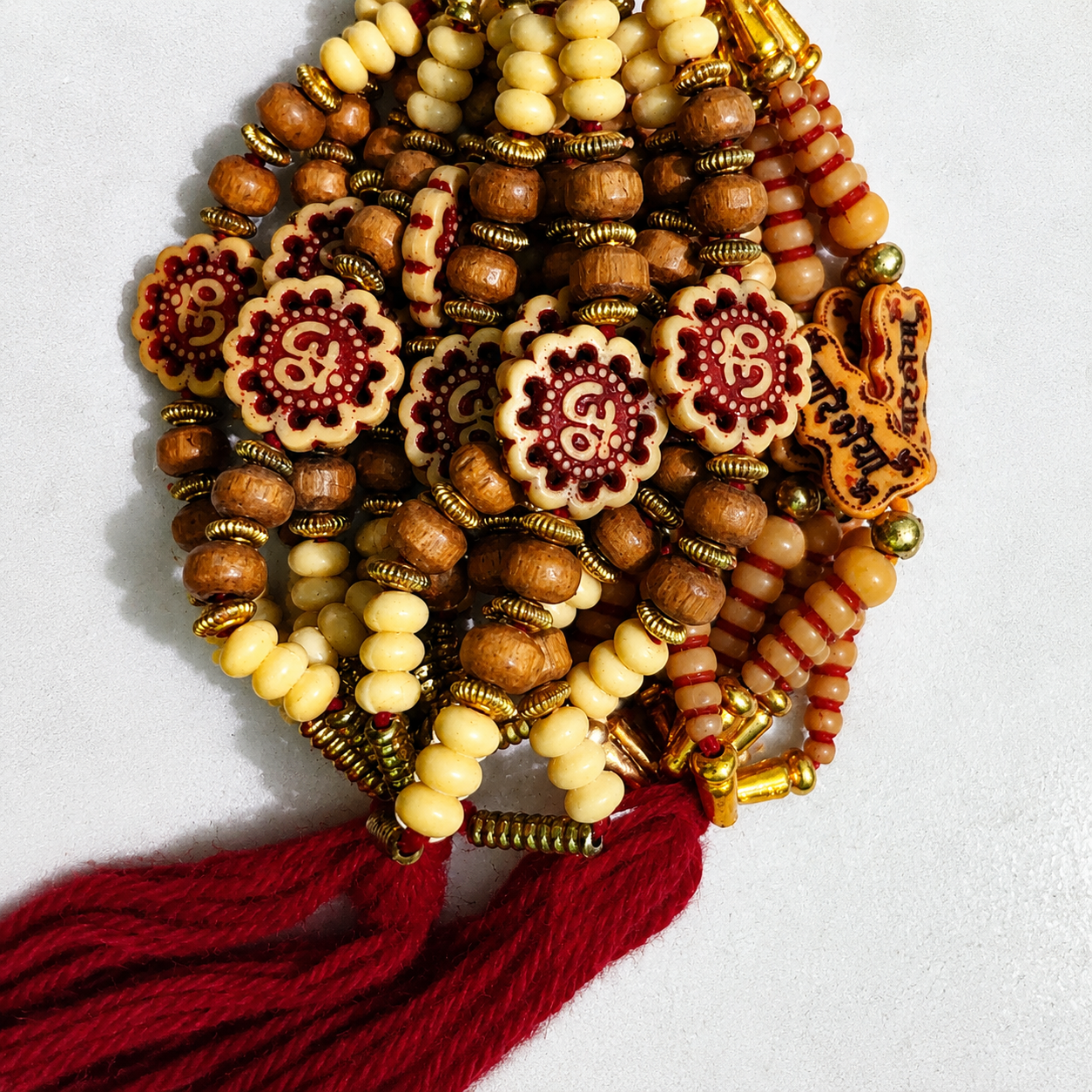 Handcrafted Om Beads Rakhi with Wooden Beads & Red Tassel | Traditional Rakhi for Brother