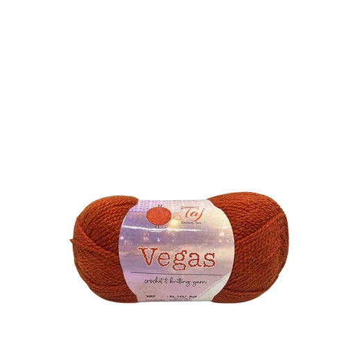 Ball of orange yarn with a 'Vegas' label on a white background