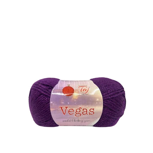 A skein of purple yarn with a white paper label that reads 'Vegas' 