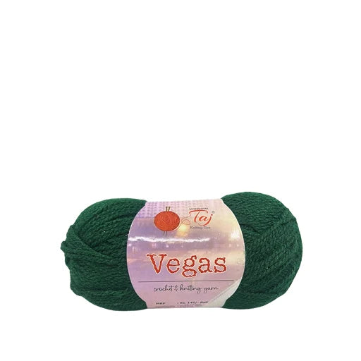 A skein of dark green credit knit yarn wrapped with a white and pink paper label that reads 'Vegas'